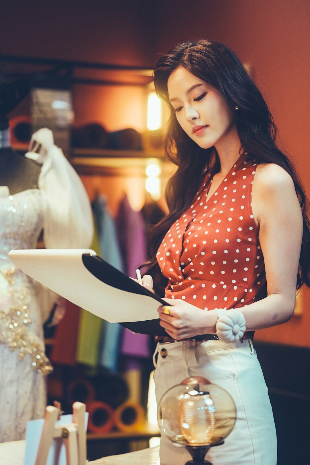 elegant woman trying on luxury dress