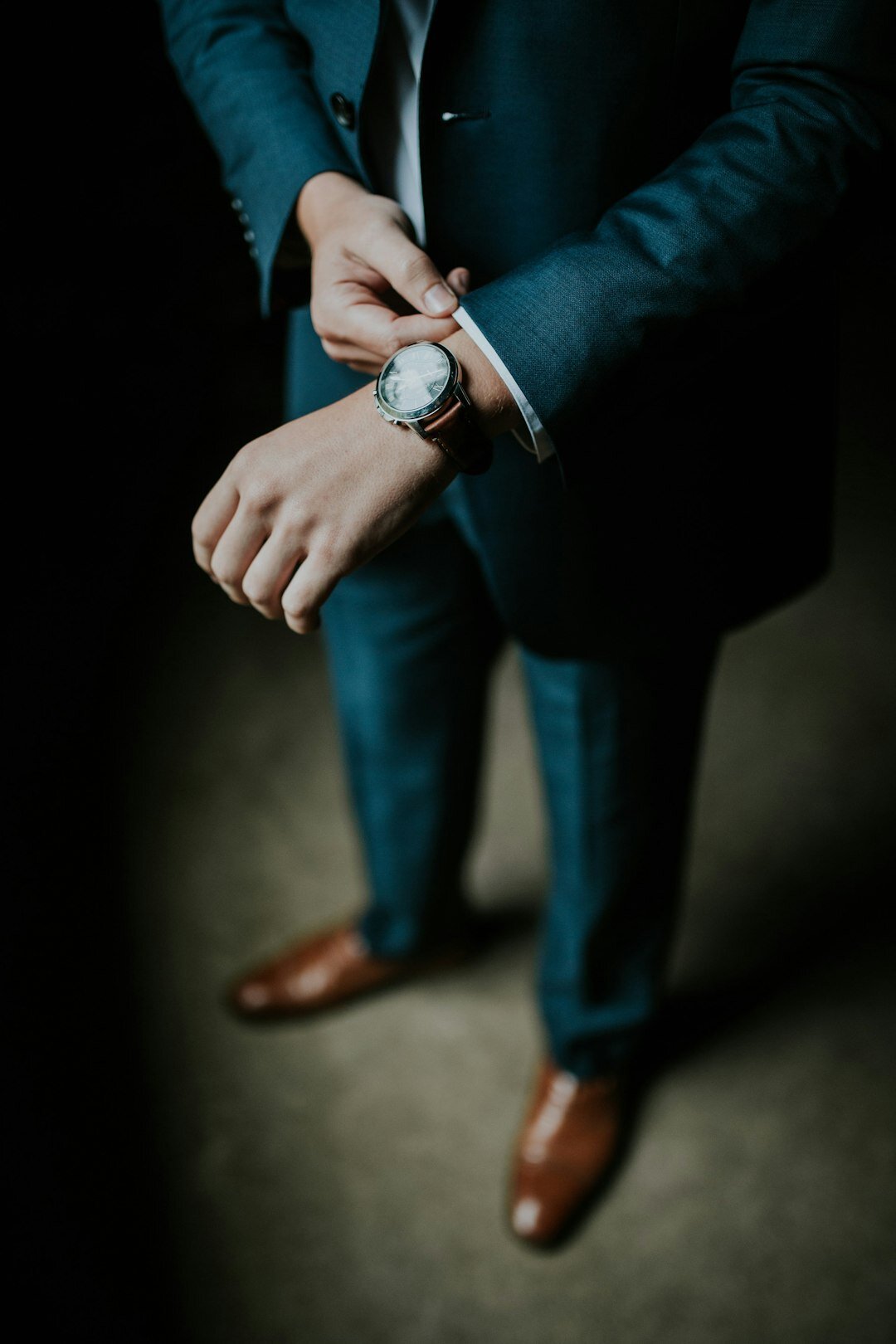 person adjusting luxury watch